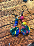 Handmade rainbow polymer clay dangle earrings with colorful beaded accents