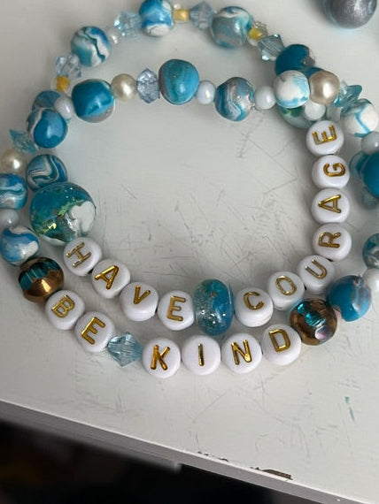 Handmade Cinderella-themed bracelet set with 'Have Courage, Be Kind' letter beads and hidden Mickey resin beads