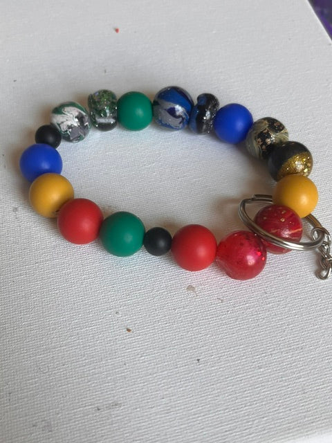 Colorful large beaded keychain with polymer clay and rubber beads in red, blue, yellow, green and black